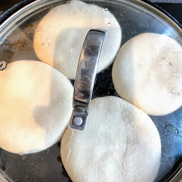 xianbing chinese meat pie lid on pan