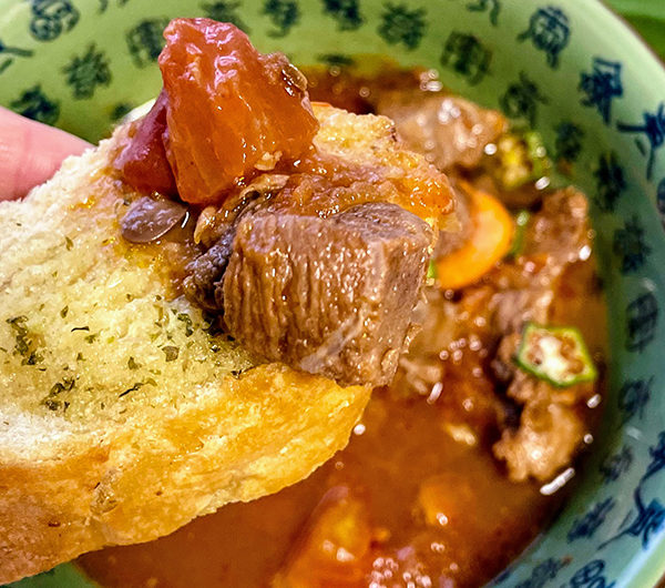 chinese beef tomato stew eating