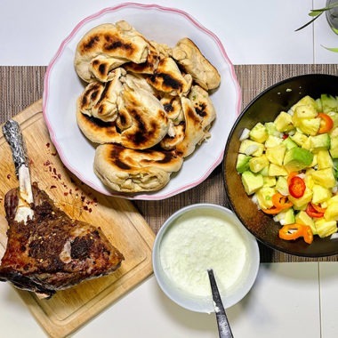 roast lamb scallion bread and tzatziki ready to eat