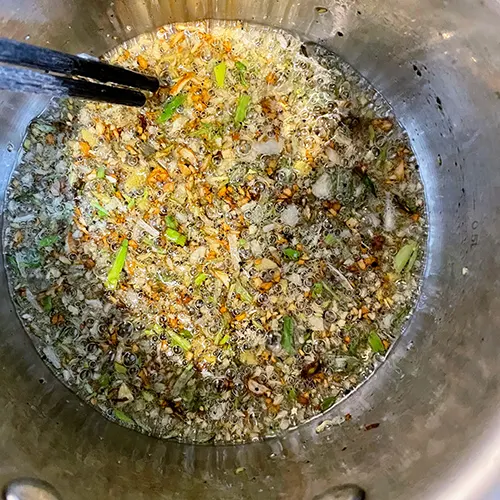 pork and fennel stalks and fronds dumplings spices in pot