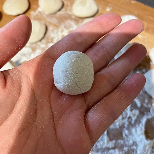 handmade chinese dumpling wrappers dough in a ball