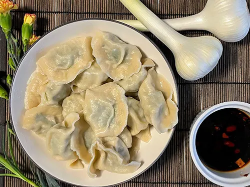 pork and fennel stalks and fronds dumplings served