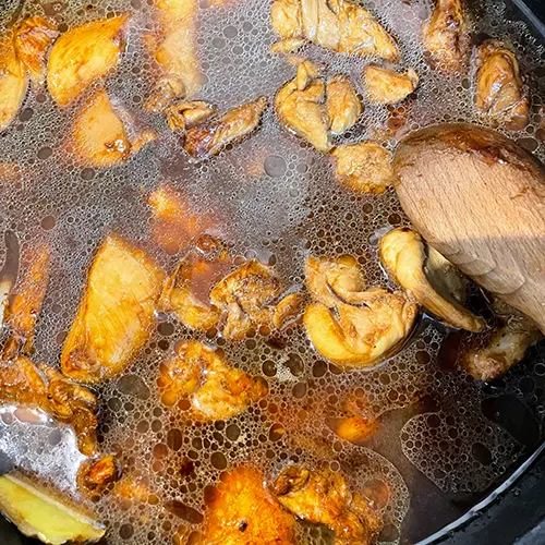 chinese bean paste braised chicken mushroom juice in pan