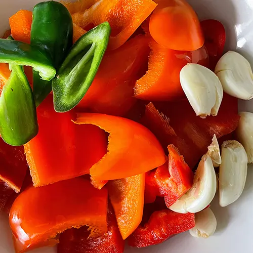 ground pot chicken bell peppers, garlic and chillies cut