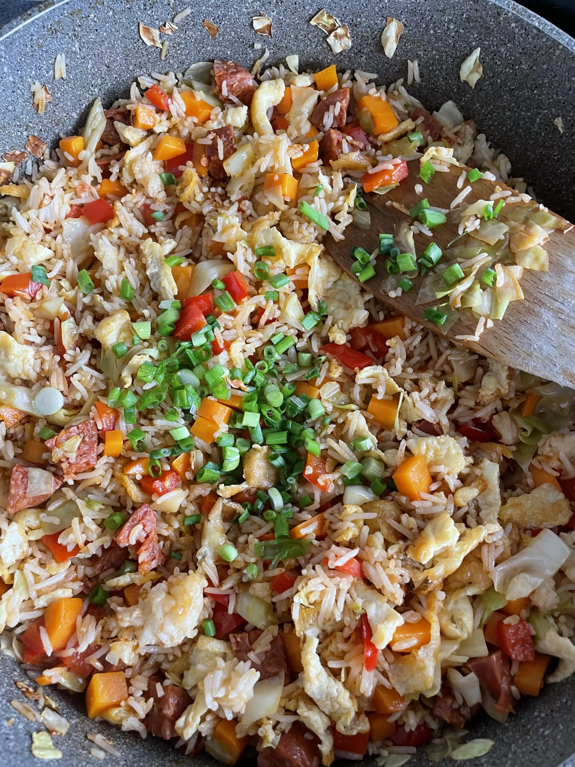 chinese egg fried rice springs onion garnish added