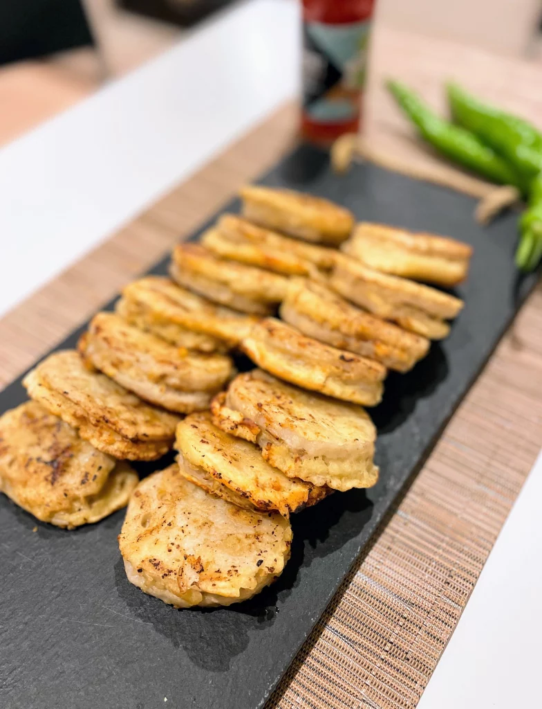 Golden crispy lotus root pork patties on plate