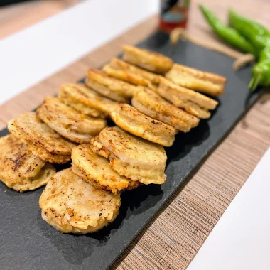 Golden crispy lotus root pork patties on plate