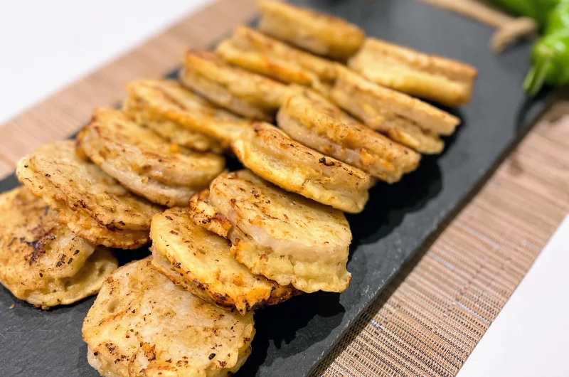 Golden crispy lotus root pork patties on plate