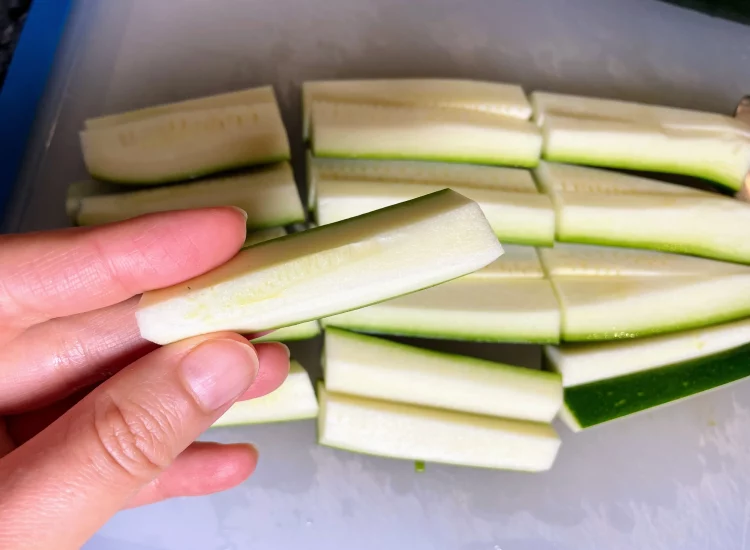 Courgette strips sliced into halves and cut into even lengths for a crunchy texture.