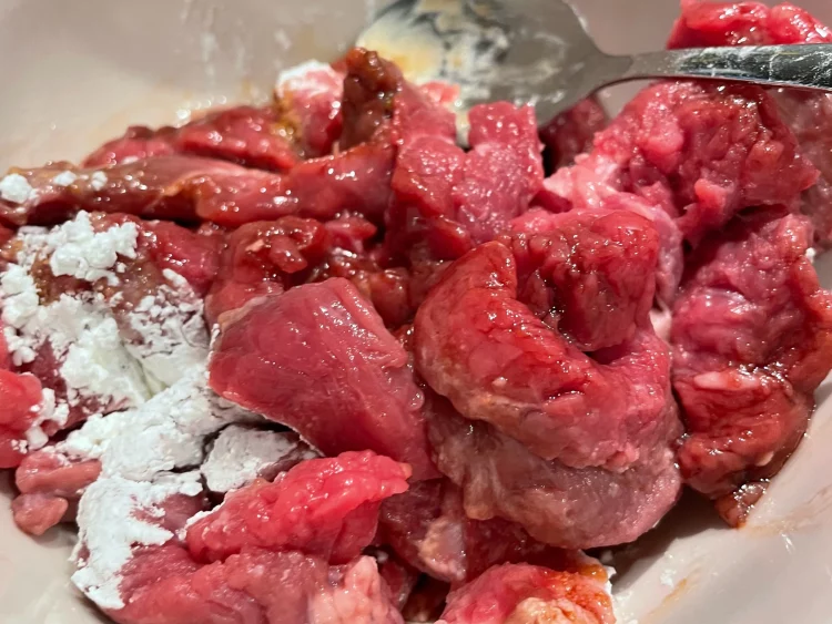 Marinated beef with soy sauce, cooking wine, cornstarch, and black pepper